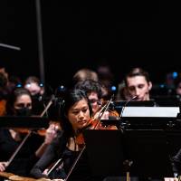 photo of violin faculty member Letitia Jap playing with the violin section
